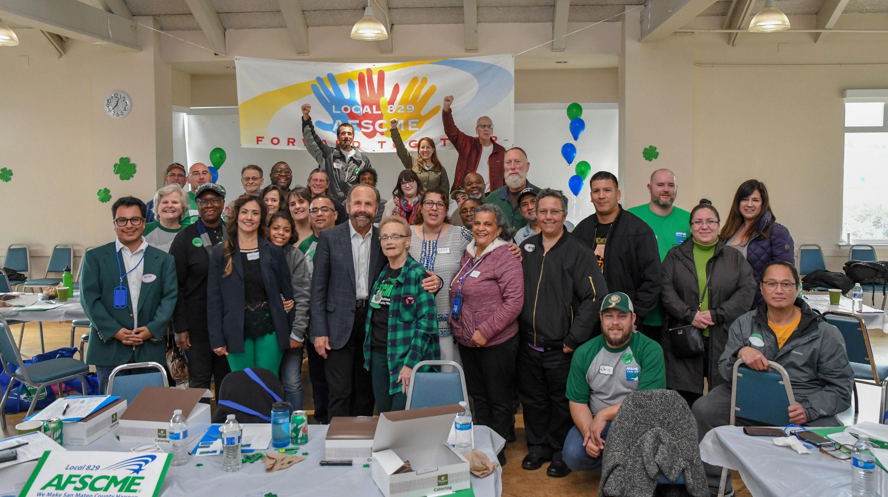 California State Sen. Jerry Hill takes a photo with AFSCME Local 829 members at their rally in Belmont